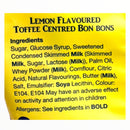 Yellow label with ingredients list for lemon-flavored toffee centred bonbons on a white background