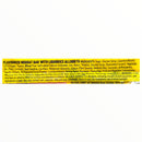 Yellow and black ingredient label for a nougat bar with liquorice allsorts on a white background
