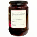 Jar of sliced beetroot in vinegar with a label on a white background