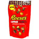Reese's Dipped Peanuts with a brown polka dot top on a white background