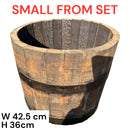 Wooden barrel planter with dimensions on a white background