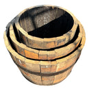Stack of wooden barrels on a white background